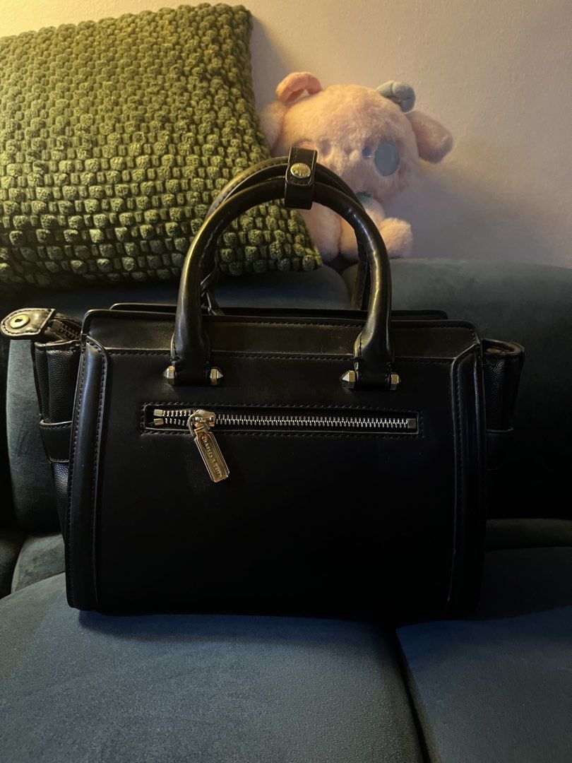 Charles & Keith Black Structured Handbag (Category: Luxury Bags & Wallets) located in Quezon City. Submitted by emimichii (Listing ID 1464945899, Image 2). Description: -signs of wear and scratches, i think it can be fixed with leather care -still sturdy -rfs: declutter, no use anymore .
