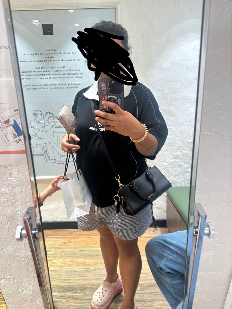 Charles & Keith Kerry Top Handle Bag Black (Category: Tote Bags) located in Manila. Submitted by kimmmmy_ (Listing ID 1464793796, Image 2). Description: - Authentic Charles & Keith Kerry top handle bag in versatile black - Structured rectangular shape with elegant gold hardware - Includes a stylish lock charm accessory on the handle - Clean, smooth exterior finish that pairs with any outfit - Spacious interior with plenty of room for daily essent