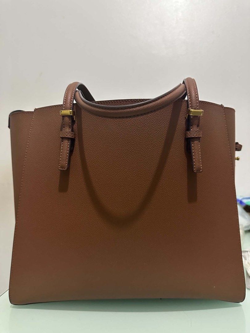Charles & Keith Sansa Tote (Category: Tote Bags) located in Quezon City. Submitted by migswee07 (Listing ID 1464871805, Image 1). Description: Bag in Chocolate/Brown XL 3k Negotiable Lightly Used.