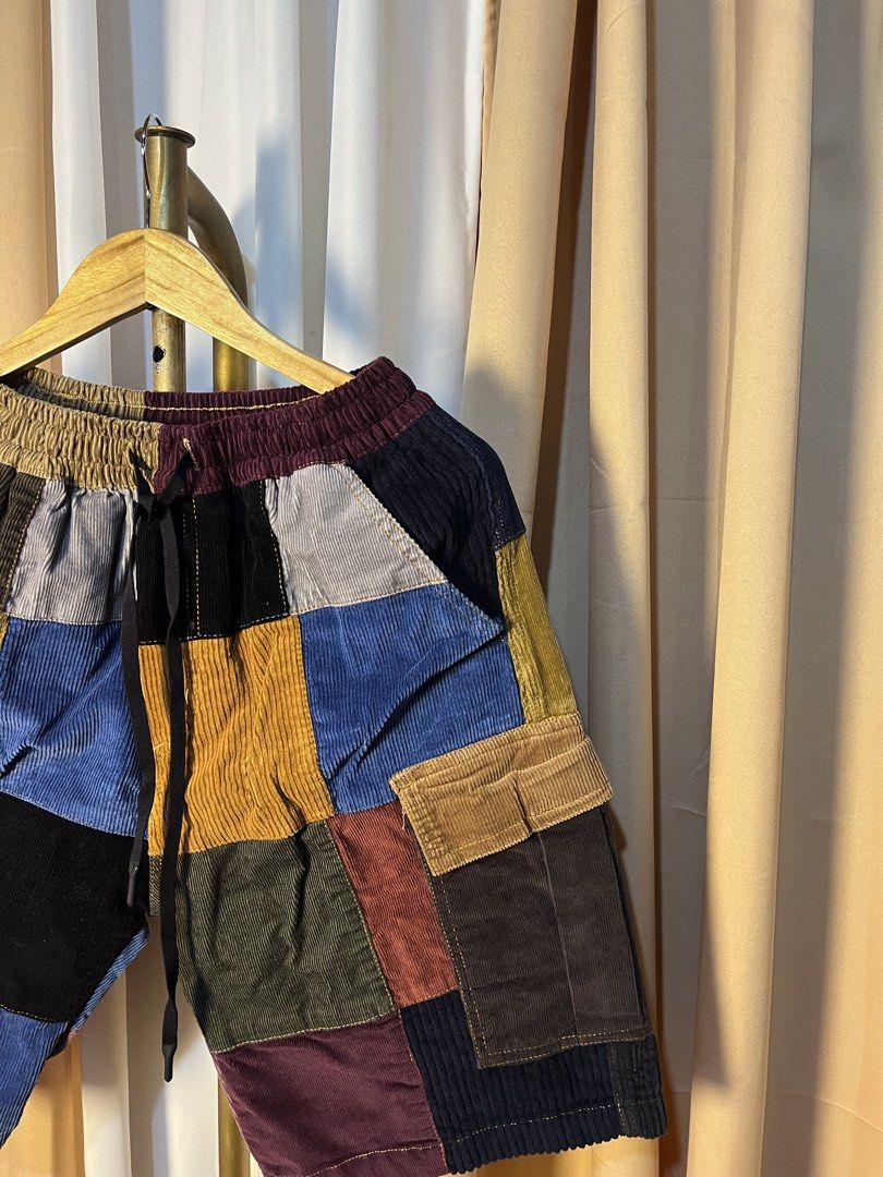 Chea Kunthy Patchwork Corduroy Shorts (Category: Activewear) located in Kidapawan. Submitted by azythrift (Listing ID 1464915507, Image 2). Description: - Brand: Chea Kunthy - Material: 100% Cotton corduroy - Design: Unique multicolored patchwork color-block (brown, blue, green, black, burgundy, tan) - Waistband: Elastic with black adjustable drawstring - Pockets: Functional side cargo pockets and rear pockets - Origin: Made in Cambodia - Conditi