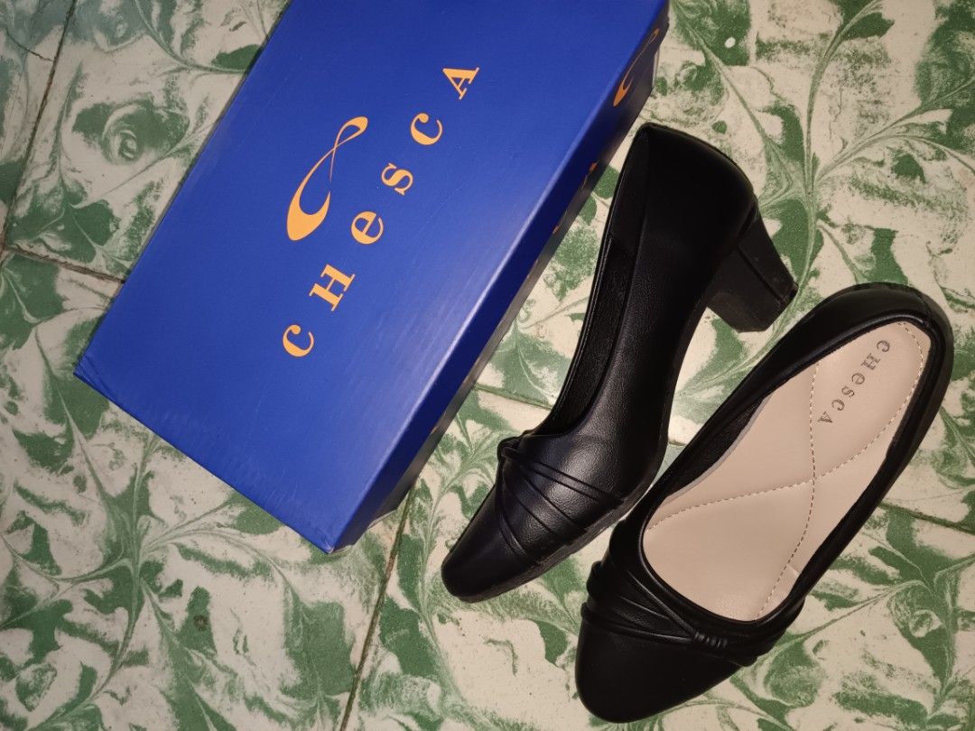 Chesca Black Heels Size 37 with Box (Category: Heels) located in Manila. Submitted by maulionjus77854 (Listing ID 1464807479, Image 1). Description: - Brand: Chesca - Size: 37 - Color: Black - Condition: Brand new, never worn, pristine condition - Features: Elegant block heel with pleated strap detail and comfortable neutral inner lining - Inclusions: Original blue box from SM Store with original ₱1,499 price tag attached.