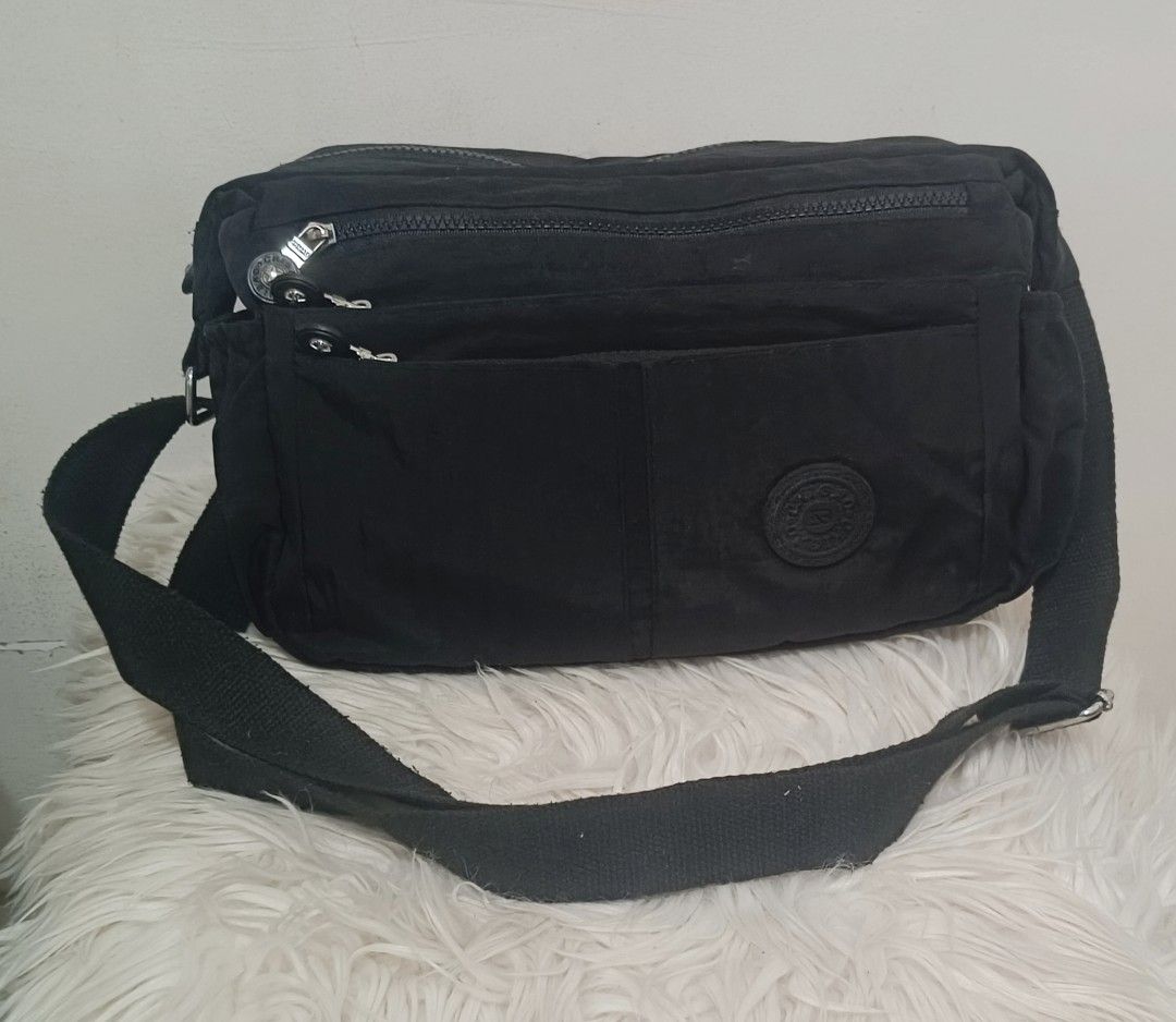 Chibao Nylon Sling bag (Category: Cross-body Bags) located in Davao. Submitted by naxarugal (Listing ID 1464880648, Image 1). Description: ukay source no issue size length 11 inches width 3.5 inches height 7.5 inches.
