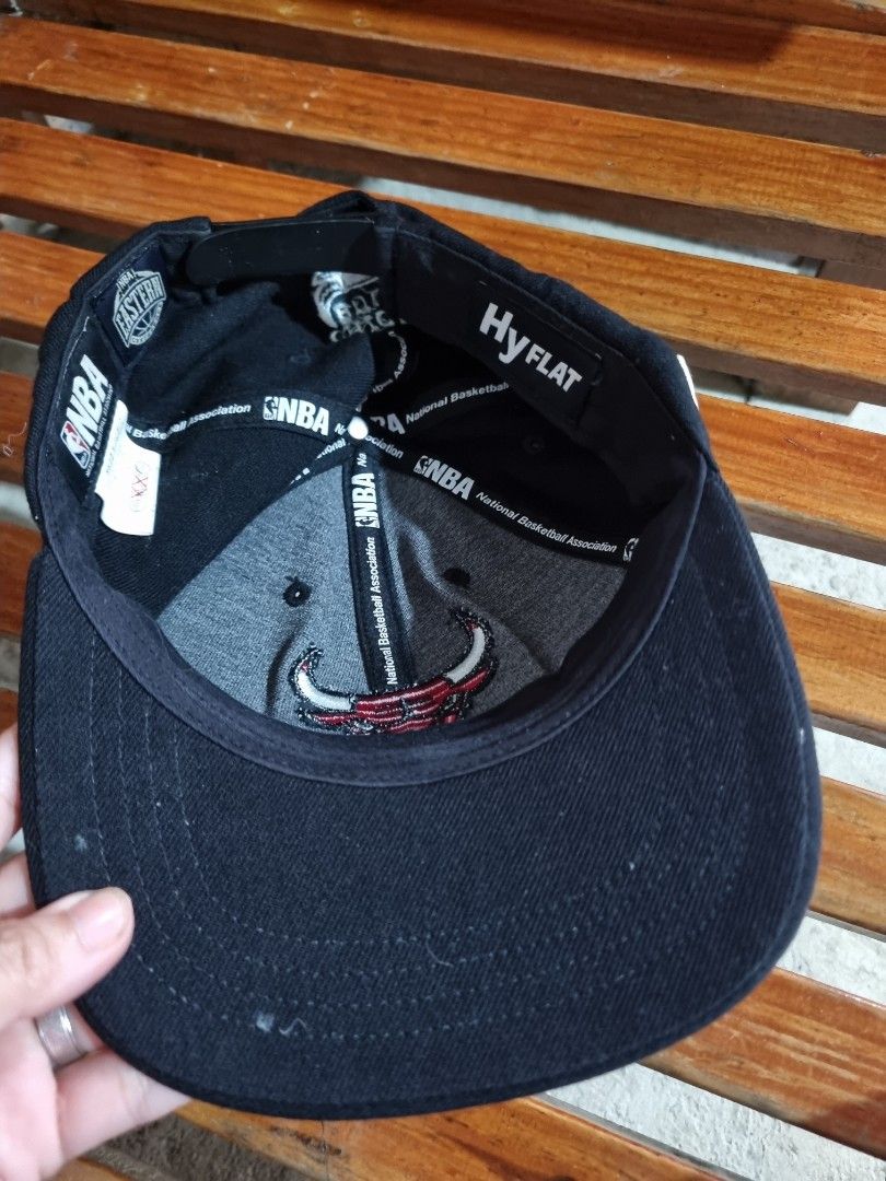 Chicago Bulls NBA Flat Brim Cap Black (Category: Caps & Hats) located in Baguio. Submitted by phoeberose33384 (Listing ID 1464814174, Image 2). Description: - Official NBA merchandise featuring the classic black Chicago Bulls design - High-quality embroidered Bulls logo on the front panels - Adjustable snapback closure for a custom and comfortable fit - Clean interior lining with branded taping and original NBA tags intact - Flat brim style, perf