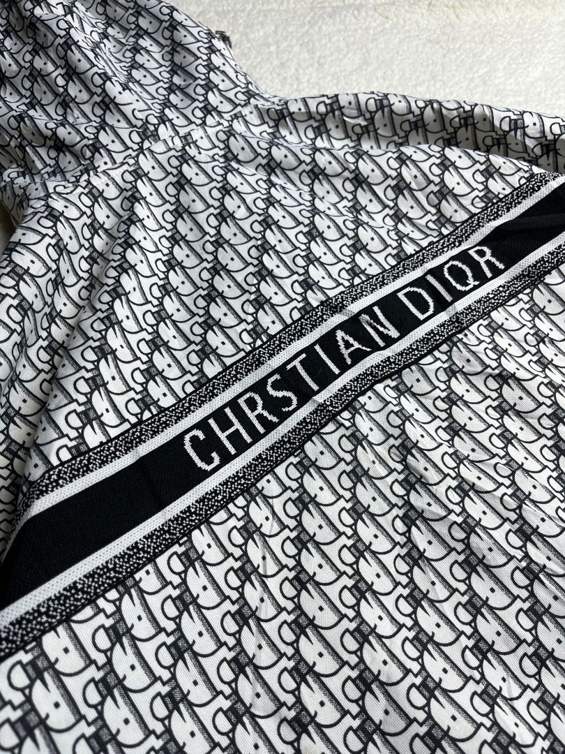 Christian Dior Monogram Zip Hoodie Jacket (Category: Coats, Jackets and Outerwear) located in Leyte. Submitted by carlthriftwearapparel (Listing ID 1464820715, Image 1). Description: - Brand: Christian Dior - Design: Black & white monogram all-over print with signature front band - Features: Full zip front, hooded, smooth silver-tone hardware, ribbed cuffs and hem - Condition: Clean fabric, great layering piece - Measurements: ~22" across chest, 