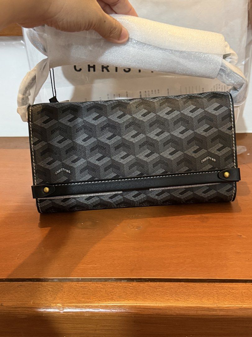 Christy Ng Diego (Category: Luxury Bags & Wallets) located in Manila. Submitted by maryjoremf13085 (Listing ID 1464965788, Image 1). Description: - Brand: Christy Ng - Color: Classic Black with chic repeating geometric pattern - Condition: Brand new with tags and protective foam on handles - Design: Structured rectangular shape with stylish horizontal front strap and metal button accents - Style: Versatile and chic shoulder bag for daily use or s