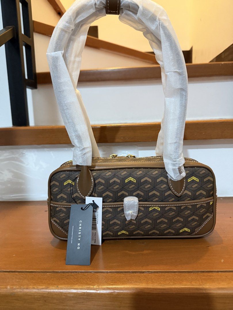 Christy Ng Marcelo Shoulder (Category: Luxury Bags & Wallets) located in Manila. Submitted by maryjoremf13085 (Listing ID 1464965751, Image 3). Description: - Brand: Christy Ng Marcelo - Condition: Brand new with tags (BNWT), handles still in protective foam - Design: Geometric pattern with stylish contrast stitching - Hardware: Premium gold-toned hardware - Compartments: Secure top zipper closure plus a handy front compartment - Colors Available