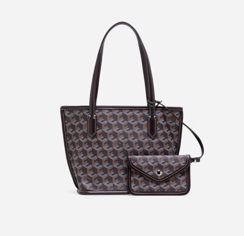 Christy Ng Russo Mini Tote Bag (Category: Tote Bags) located in Pasig City. Submitted by jnnnngg (Listing ID 1464923528, Image 1). Description: - Used once -RFS: not mom friendly, bought the larger version Stylish geometric cube print tote bag with dark brown leather handles and trim - Open top design with a spacious interior for all your daily essentials - Includes a cute matching envelope-style dangling pouch with a metallic snap closure - Vers
