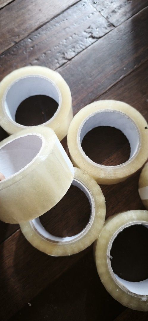 Clear Packing Tape Rolls Set (Category: Craft Supplies & Tools) located in Malabon City. Submitted by ph_ohkaye (Listing ID 1464966437, Image 2). Description: - Type: Clear adhesive tape rolls - Use: Ideal for packaging, moving, and office work - Quality: Strong stickiness, durable transparent plastic - Size: 200m - slightly dented 30 pesos per pc.