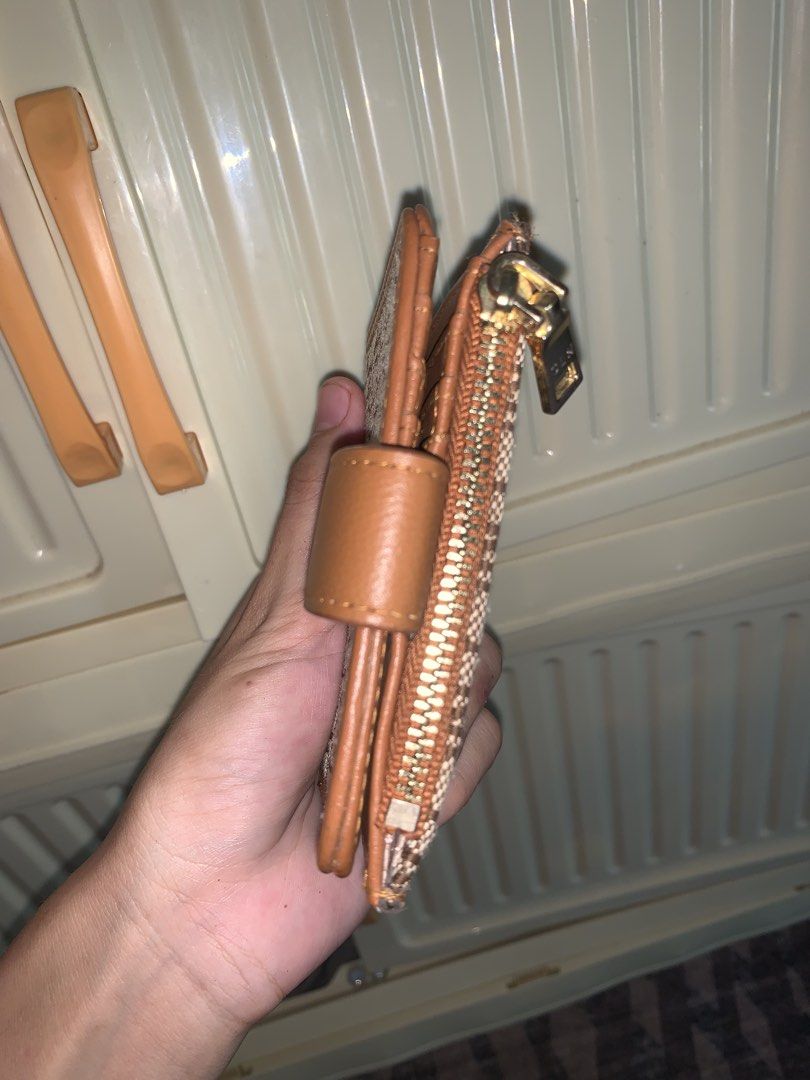 CLN Brown Monogram Short Wallet (Category: Luxury Bags & Wallets) located in Manila. Submitted by jessa480 (Listing ID 1464797077, Image 3). Description: NEGO - Brand: CLN - Color: Brown with monogram print and tan faux leather trim - Closure: Strap closure with gold-tone logo plaque - Compartments: Zip coin compartment on the back - Size: Compact, fits easily into small bags or pockets AUTHENTIC. GIFT lang to sakin mas gusto ko long wallets and 