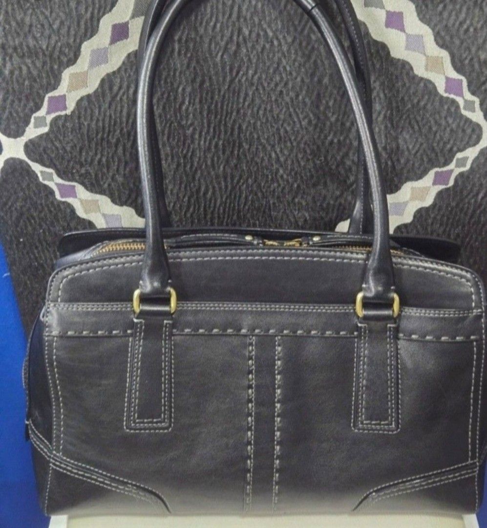 Coach Black Leather Shoulder Bag (Category: Shoulder Bags) located in Quezon City. Submitted by affordabags_cd (Listing ID 1464967865, Image 2). Description: - Brand: Coach - Material: Premium black leather with gold-tone hardware - Design: Contrast white stitching with embossed Coach logo - Closure: Top zipper with double leather pull tabs plus front turn-lock pocket - Straps: Double shoulder straps / dual top carry handles - Interior: Clean lig