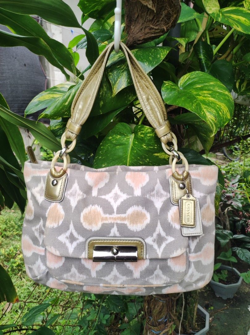 Coach Kristin Ikat Hobo (Category: Luxury Bags & Wallets) located in Naguilian. Submitted by a2aonlineshop (Listing ID 1464856747, Image 1). Description: Style no.: Coach no. 16983 Model: Coach Kristin Ikat Hobo Design/Pattern: Op Art Ikat print Color: ivory, gray, coral & tan Manufactured Date: Feb, 2011 (vintage) Material: Canvas with touch of pattent leather Condition: like new, nothing to explain the owner never used it..