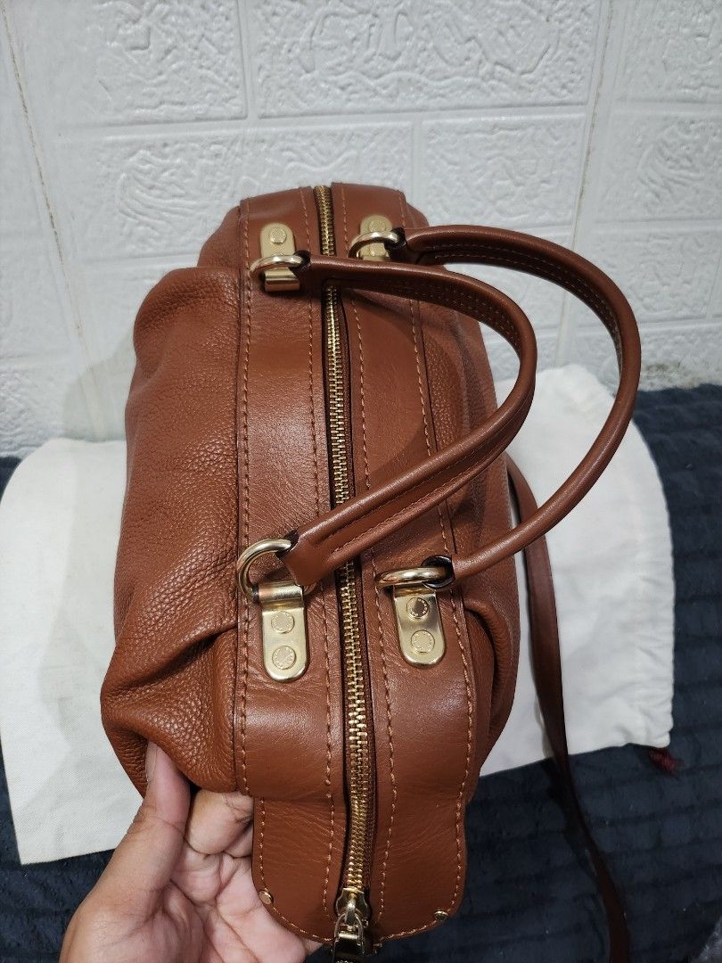 Coach Lane Satchel Bag (Category: Luxury Bags & Wallets) located in Caloocan City. Submitted by xcessbaggs (Listing ID 1464962519, Image 3). Description: New Arrival!!! In good pre-loved condition from Korea. 📌Materials: Crafted from a mix of textured polished pebble leather and smooth refined calf leather. 📏Dimensions: Approximately 12" L x 7" H x 5.5" W. See photos and item specifics for details and condition ✉️Send me a message for queries a