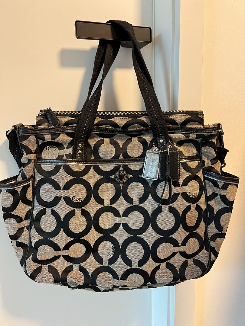 Coach large diaper bag (Category: Shoulder Bags) located in Makati City. Submitted by purple_juicy16 (Listing ID 1464935186, Image 1). Description: This appears to be a Coach Black and White Signature Op Art X-Large Diaper Bag (Style No. 16981) featuring a bold circular monogram pattern, double utility handles, and side bottle pockets.