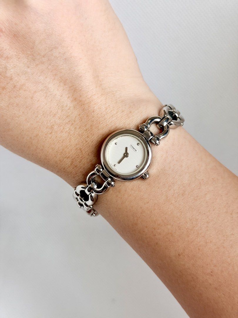 Coach Neo-Vintage Y2K (Category: Women's Watches) located in Manila. Submitted by vibeandvintage (Listing ID 1464811384, Image 2). Description: ⌚️ Coach Neo-Vintage Y2K •Ladies •Quartz movement •Off-white/silver vertical pinstripe patterned guilloché texture dial •Stainless steel case and bracelet •Up to 6.5 inches wrist size •20mm case diameter (excluding crown) •With signs of usage •All-original watch head and bracelet •Good working condition •