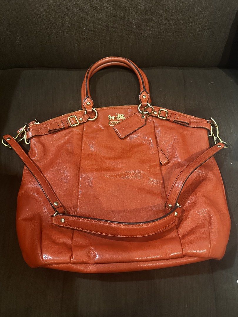 Coach Orange Leather Tote Shoulder Bag (Category: Luxury Bags & Wallets) located in Pasig City. Submitted by zen.catgirl (Listing ID 1464788688, Image 1). Description: Selling my Coach Madison Leather Lindsey Satchel (Style No. 18641) in burnt orange/cognac pebbled leather with brass/gold-tone hardware. Bought in Coach store in HongKong. In very good condition. Very minimal corner wear, a pristine interior (satin lining without pen/makeup stains)