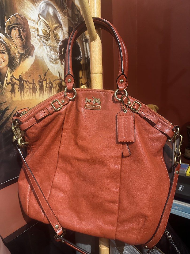 Coach Orange Leather Tote Shoulder Bag (Category: Luxury Bags & Wallets) located in Pasig City. Submitted by zen.catgirl (Listing ID 1464788688, Image 2). Description: Selling my Coach Madison Leather Lindsey Satchel (Style No. 18641) in burnt orange/cognac pebbled leather with brass/gold-tone hardware. Bought in Coach store in HongKong. In very good condition. Very minimal corner wear, a pristine interior (satin lining without pen/makeup stains)