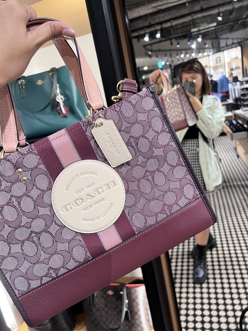 Coach Outlet Dempsey Carryall (Category: Shoulder Bags) located in Manila. Submitted by ihshey (Listing ID 1464896090, Image 1). Description: Coach Outlet Dempsey Carryall Signature Jacquard with Stripe & Coach Patch 👜 ✨ Condition: 9/10 - Gently used — only worn 3x since purchase - Has visible signs of use on the purse feet (please see photos) - Personally purchased in Japan 🇯🇵 - Bought from Mitsui Outlet Park Tama Minami-Osawa RFS: Declutteri