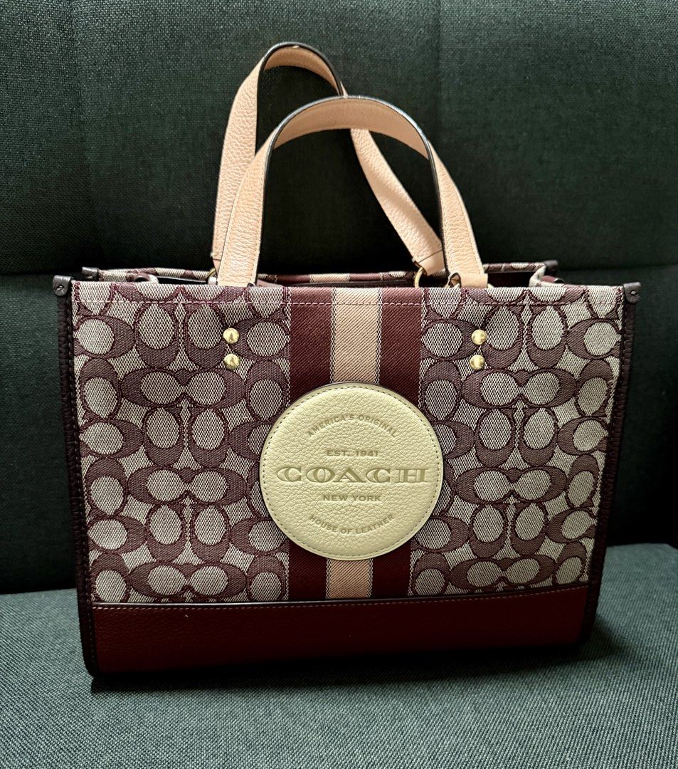 Coach Outlet Dempsey Carryall (Category: Shoulder Bags) located in Manila. Submitted by ihshey (Listing ID 1464896090, Image 2). Description: Coach Outlet Dempsey Carryall Signature Jacquard with Stripe & Coach Patch 👜 ✨ Condition: 9/10 - Gently used — only worn 3x since purchase - Has visible signs of use on the purse feet (please see photos) - Personally purchased in Japan 🇯🇵 - Bought from Mitsui Outlet Park Tama Minami-Osawa RFS: Declutteri