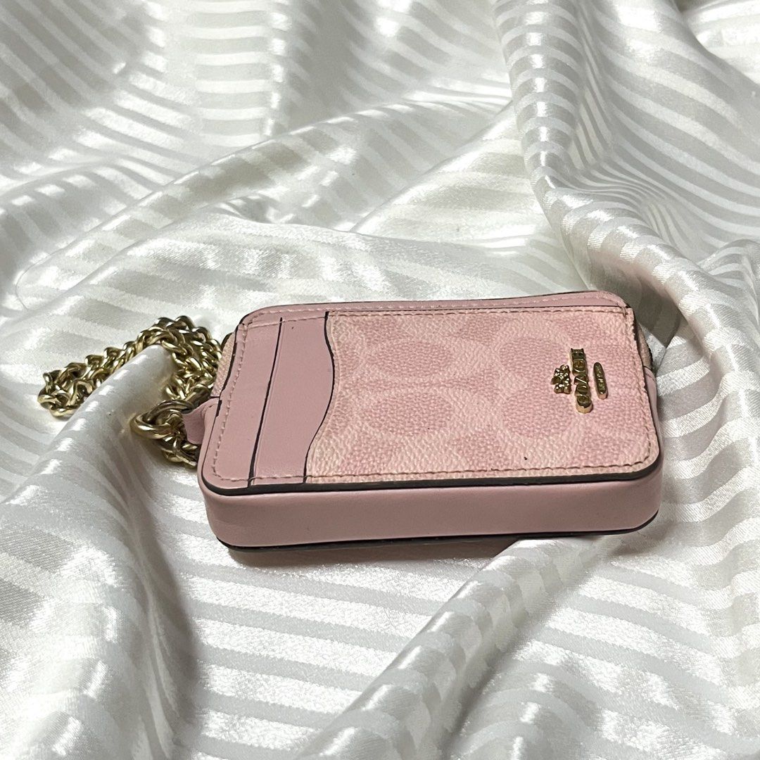 COACH PINK CARD HOLDER WALLET (Category: Wallets & Card holders) located in Manila. Submitted by ave.archives (Listing ID 1464887197, Image 2). Description: NOTE: The wallet is currently unable to zip closed. It was deep-washed once, and afterward the zipper developed some buildup/discoloration. I’m not sure if it is oxidation/rust or residue, so I’m selling it AS IS. The zipper may possibly be repairable or replaceable by a repair shop. Exterior