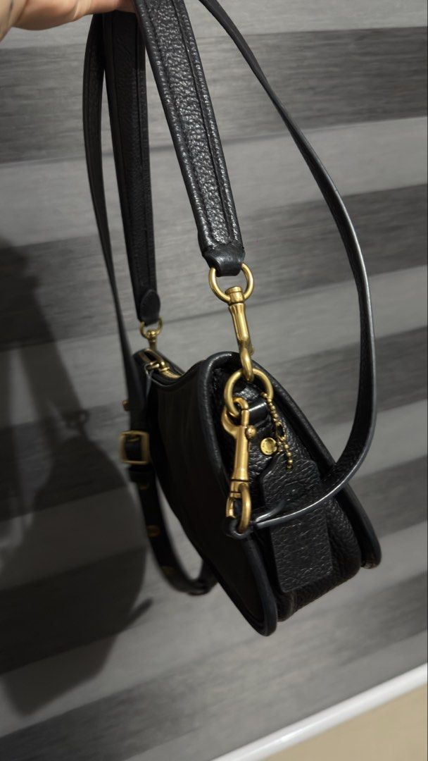 Coach Swinger 22 Retail Bag (Category: Cross-body Bags) located in Las Pinas. Submitted by mharjrahm (Listing ID 1464891716, Image 2). Description: - Brand: Coach - Material: Durable black nylon with pebbled leather trim - Hardware: Classic brass - Closure: Secure zipper top with stylish front turnlock accent - Strap: Removable and adjustable with buckle, includes original leather hangtag - Condition: Clean overall with minimal signs of wear - Si