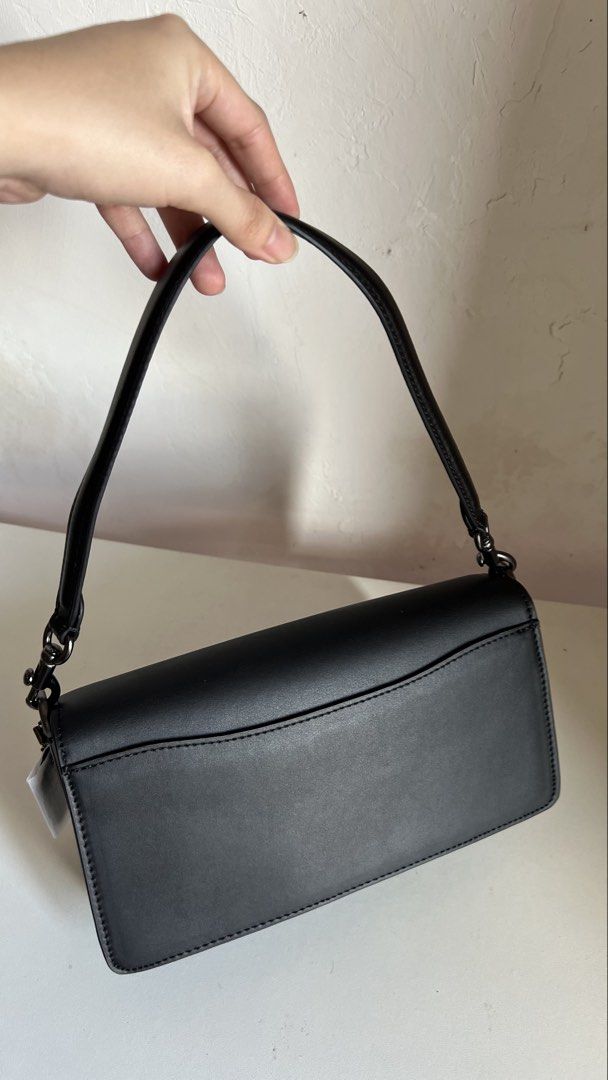 Coach Tabby Shoulder Bag Black (Category: Shoulder Bags) located in Manila. Submitted by obbusemer38788 (Listing ID 1464828849, Image 3). Description: - Brand: Coach - Color: Classic Black - Material: Smooth leather with textured panels - Hardware: Gunmetal with iconic C clasp closure - Strap: Single detachable strap with sturdy metallic clasps - Compartments: Back slip pocket for quick access - Style: Clean, structured silhouette perfect for day