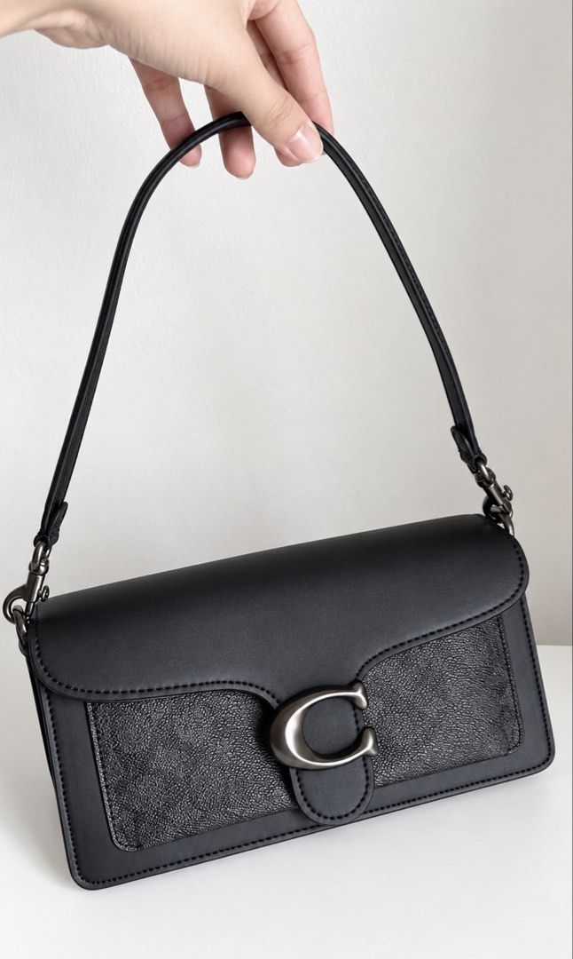 Coach Tabby Shoulder Bag Black (Category: Shoulder Bags) located in Manila. Submitted by obbusemer38788 (Listing ID 1464828849, Image 1). Description: - Brand: Coach - Color: Classic Black - Material: Smooth leather with textured panels - Hardware: Gunmetal with iconic C clasp closure - Strap: Single detachable strap with sturdy metallic clasps - Compartments: Back slip pocket for quick access - Style: Clean, structured silhouette perfect for day