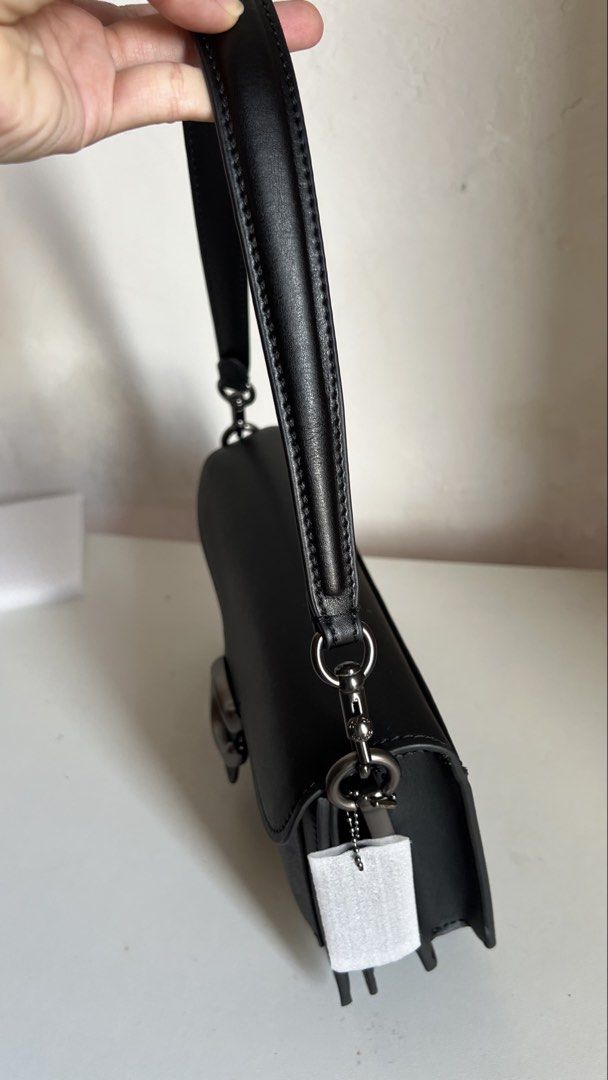 Coach Tabby Shoulder Bag Black (Category: Shoulder Bags) located in Manila. Submitted by obbusemer38788 (Listing ID 1464828849, Image 2). Description: - Brand: Coach - Color: Classic Black - Material: Smooth leather with textured panels - Hardware: Gunmetal with iconic C clasp closure - Strap: Single detachable strap with sturdy metallic clasps - Compartments: Back slip pocket for quick access - Style: Clean, structured silhouette perfect for day