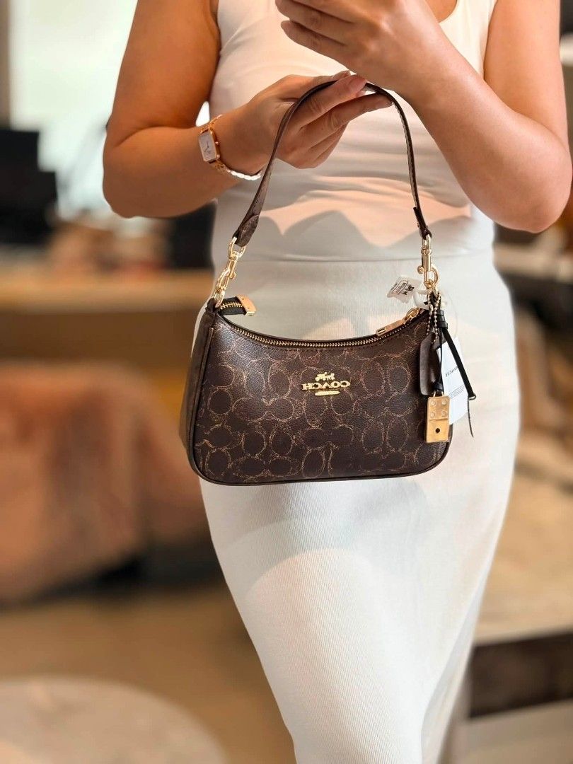 Coach Teri Shoulder Bag (Category: Shoulder Bags) located in Quezon City. Submitted by bagsboutiqueph (Listing ID 1464967812, Image 1). Description: LAST PRICE POSTED. LIMITED STOCKS! BRANDNEW WITH INCLUSIONS. COLOR MAY SLIGHTLY VARY IN ACTUAL DUE TO LIGHTING AND CAMERA SETTING. OTHER PHOTOS WILL BE SEND DURING PURCHASE AND FOR SURE BUYERS ONLY. WHEN IN DOUBT, DO NOT ORDER. THANK YOU..