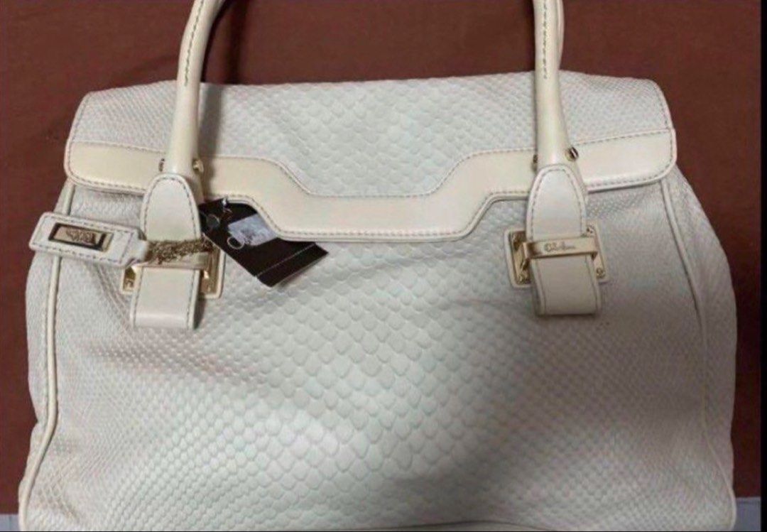 Cole Haan handbag (Category: Tote Bags) located in Manila. Submitted by bwshoppe (Listing ID 1464905130, Image 1). Description: Brand new with tag. Very classy & stylish. Size: Approximately 9.5” Hx 12 “Lx 4.5” base Made of soft leather. Easy & light to carry bag. .