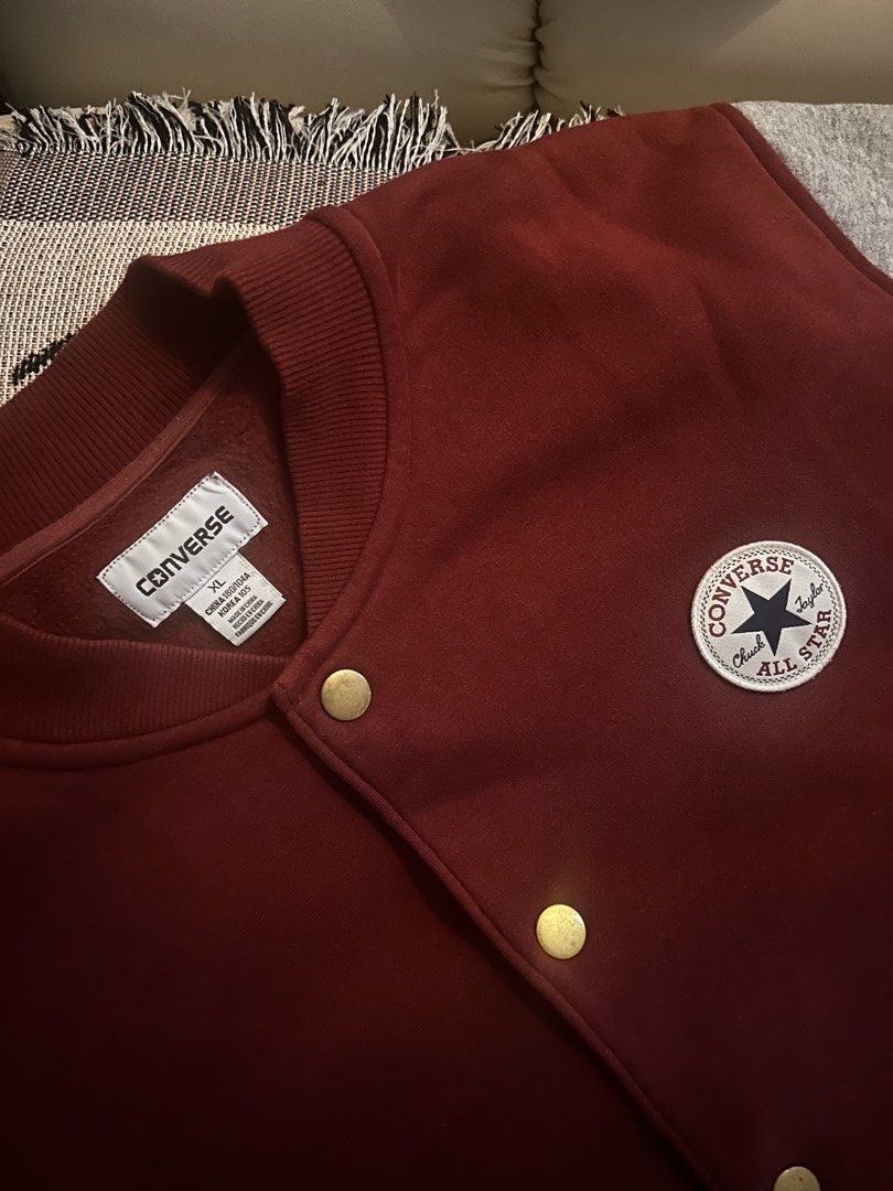 Converse Chuck Taylor Varsity Jacket Maroon Grey Size XL (Category: Coats, Jackets and Outerwear) located in Manila. Submitted by cero.eros (Listing ID 1464958964, Image 2). Description: - Brand: Converse All Star - Style: Varsity / Bomber Jacket - Color: Maroon body with heather grey sleeves - Size: XL (Korea 105 sizing) - Details: Classic chest patch, snap button closure, striped ribbed collar, cuffs, and hem, functional side pockets - Conditio