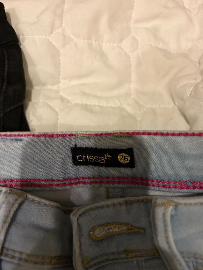 Crissa Jeans Size 26 (Category: Jeans) located in Antipolo. Submitted by renz_1 (Listing ID 1464924311, Image 2). Description: - Sizes: Both size 26 - Brand 1: Crissa (Light blue wash) - Brand 2: Redgirl Jean Wear (Black) - Fit & Style: Slim fit with front pockets and button closures - Perfect staple pieces for daily casual outfits.