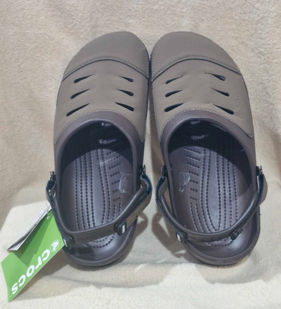 Crocs Sandals with Adjustable Strap (Category: Slippers & Slides) located in Davao. Submitted by j_guitarist (Listing ID 1464966831, Image 1). Description: - Size: EU size 42-43, US size 9 - Inner length size: 27 cm - Color: Brown - Brand: Crocs - Fit: Adjustable heel strap for a secure and comfortable fit .