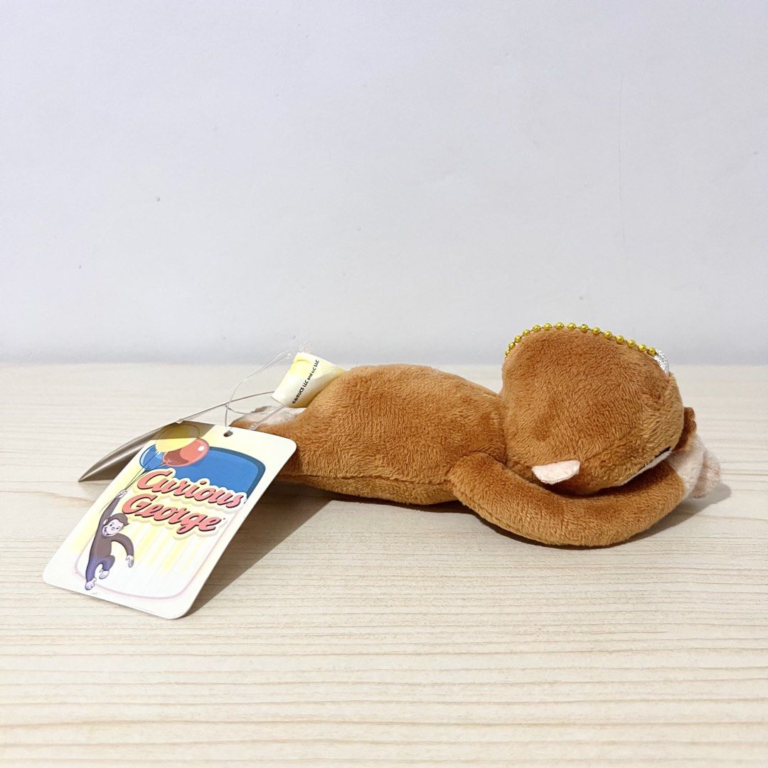 Curious George Plush Charm 15cm - Php 100 NOTE: faded tag (Category: Character Goods) located in Davao. Submitted by pandorastoybox (Listing ID 1464913210, Image 3). Description: Curious George Plush Charm 15cm - Php 100 NOTE: faded tag .