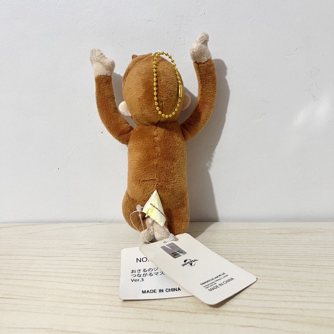 Curious George Plush Charm 15cm - Php 100 NOTE: faded tag (Category: Character Goods) located in Davao. Submitted by pandorastoybox (Listing ID 1464913210, Image 2). Description: Curious George Plush Charm 15cm - Php 100 NOTE: faded tag .