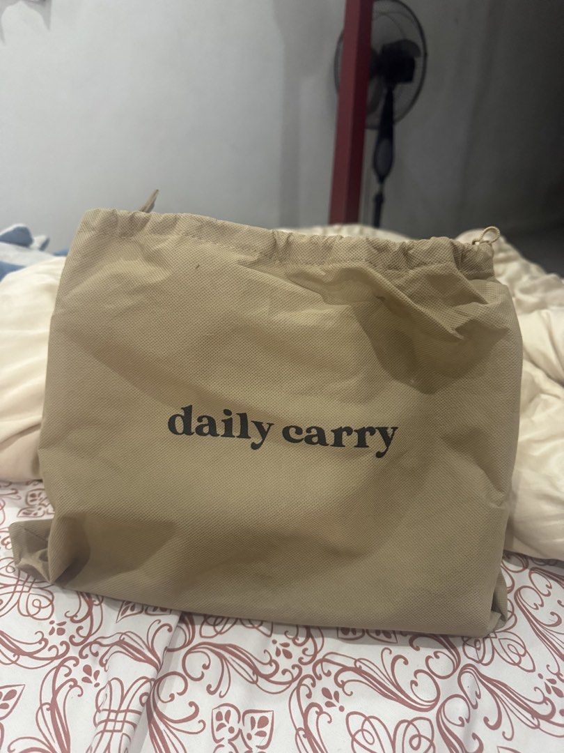 Daily Carry Beige Midi Bag (Category: Tote Bags) located in Pasig City. Submitted by miaasntz (Listing ID 1464885045, Image 2). Description: - gifted, never used - with tag and dust bag.