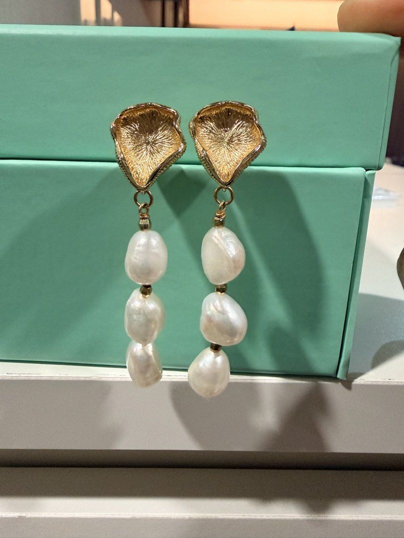 Dangling freshwater pearl earrings (Category: Earrings) located in Pasig City. Submitted by theclosetcasemanila (Listing ID 1464930828, Image 1). Description: - Gold-toned statement earrings featuring textured stud tops - Three elegant baroque pearls dangling from each side securely connected by metal loops - Good weight that feels substantial yet comfortable on the lobes .