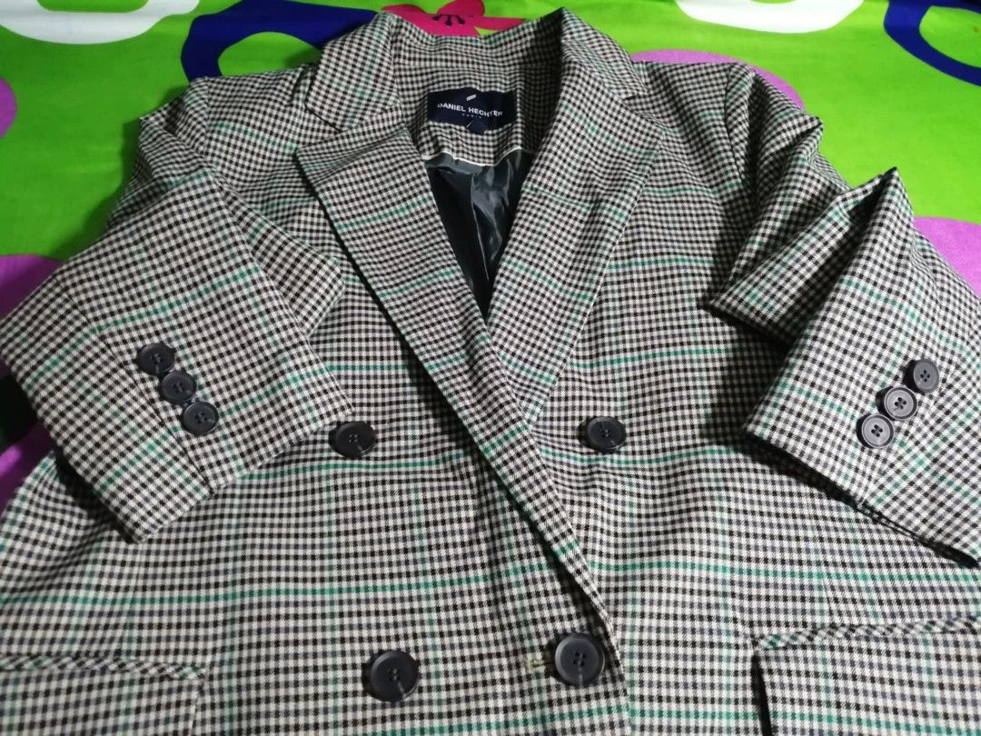 Daniel Hechter Plaid Double-Breasted Blazer (Category: Coats, Jackets and Outerwear) located in Caloocan City. Submitted by jeicee858582831 (Listing ID 1464928433, Image 1). Description: - Brand: Daniel Hechter - Style: Double-breasted blazer with structured collar and lapels - Pattern: Classic houndstooth plaid with subtle green stripes - Details: Black front and cuff buttons - Interior: Fully lined in black for comfortable wear - Condition: Exc