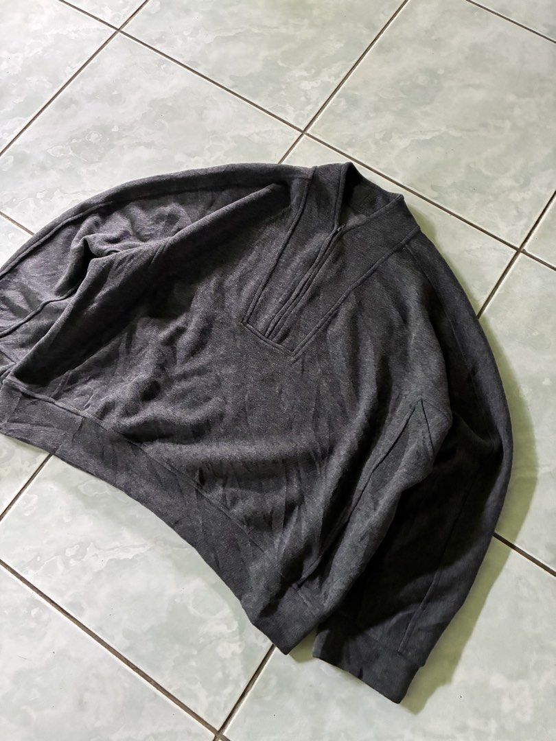 Dark Grey QZip Sweater (Category: Coats, Jackets and Outerwear) located in Batangas. Submitted by jinventoryarchive (Listing ID 1464870999, Image 2). Description: Width: 25.5 Length: 24.5 Color: Dark heather grey - Style: Mock neck with half-zip closure - Fit: Relaxed drop-shoulder fit - Details: Structured panel accents around the collar, shoulders, and sleeves - Finish: Ribbed hem and cuffs for a snug fit.