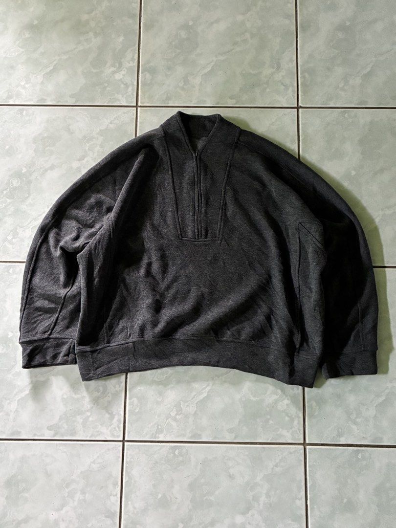 Dark Grey QZip Sweater (Category: Coats, Jackets and Outerwear) located in Batangas. Submitted by jinventoryarchive (Listing ID 1464870999, Image 1). Description: Width: 25.5 Length: 24.5 Color: Dark heather grey - Style: Mock neck with half-zip closure - Fit: Relaxed drop-shoulder fit - Details: Structured panel accents around the collar, shoulders, and sleeves - Finish: Ribbed hem and cuffs for a snug fit.