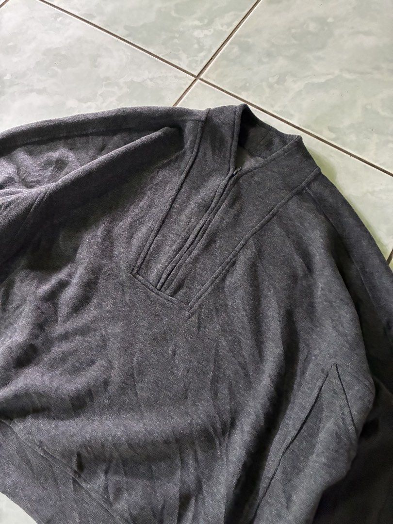 Dark Grey QZip Sweater (Category: Coats, Jackets and Outerwear) located in Batangas. Submitted by jinventoryarchive (Listing ID 1464870999, Image 3). Description: Width: 25.5 Length: 24.5 Color: Dark heather grey - Style: Mock neck with half-zip closure - Fit: Relaxed drop-shoulder fit - Details: Structured panel accents around the collar, shoulders, and sleeves - Finish: Ribbed hem and cuffs for a snug fit.