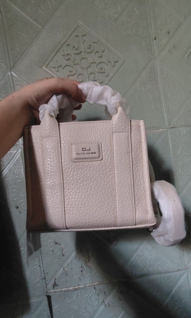 Mini tote david jones (Category: Cross-body Bags) located in Las Pinas. Submitted by anne01515 (Listing ID 1464879067, Image 1). Description: small tote, kasya cellphone, leather material. makapal ang ganda sa personal. biege color..