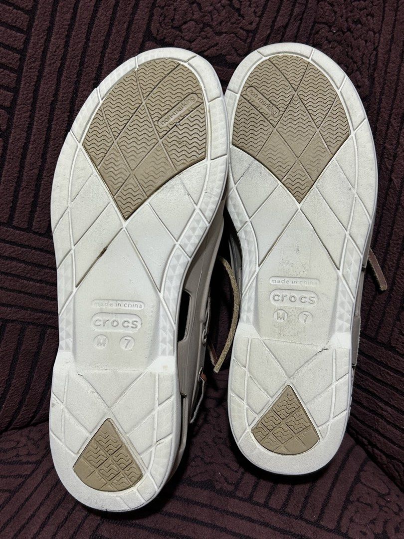 Decluttering! Personal Preloved Crocs Classic Boat Shoes (Category: Casual Shoes) located in Binan City. Submitted by lehcarsmusthaves (Listing ID 1464949960, Image 3). Description: - Brand: Crocs - Style: Boat shoes / Deck shoes - Color: Khaki with white soles and brown leather laces - Size: Men's US 7 - Features: Perforated sides for ventilation/water drainage and non-marking rubber grip outsoles - Very good used condition Issue: lace (best to 
