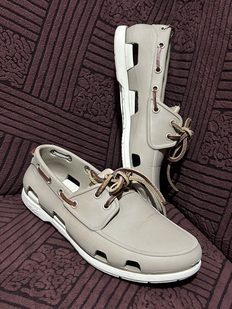 Decluttering! Personal Preloved Crocs Classic Boat Shoes (Category: Casual Shoes) located in Binan City. Submitted by lehcarsmusthaves (Listing ID 1464949960, Image 2). Description: - Brand: Crocs - Style: Boat shoes / Deck shoes - Color: Khaki with white soles and brown leather laces - Size: Men's US 7 - Features: Perforated sides for ventilation/water drainage and non-marking rubber grip outsoles - Very good used condition Issue: lace (best to 