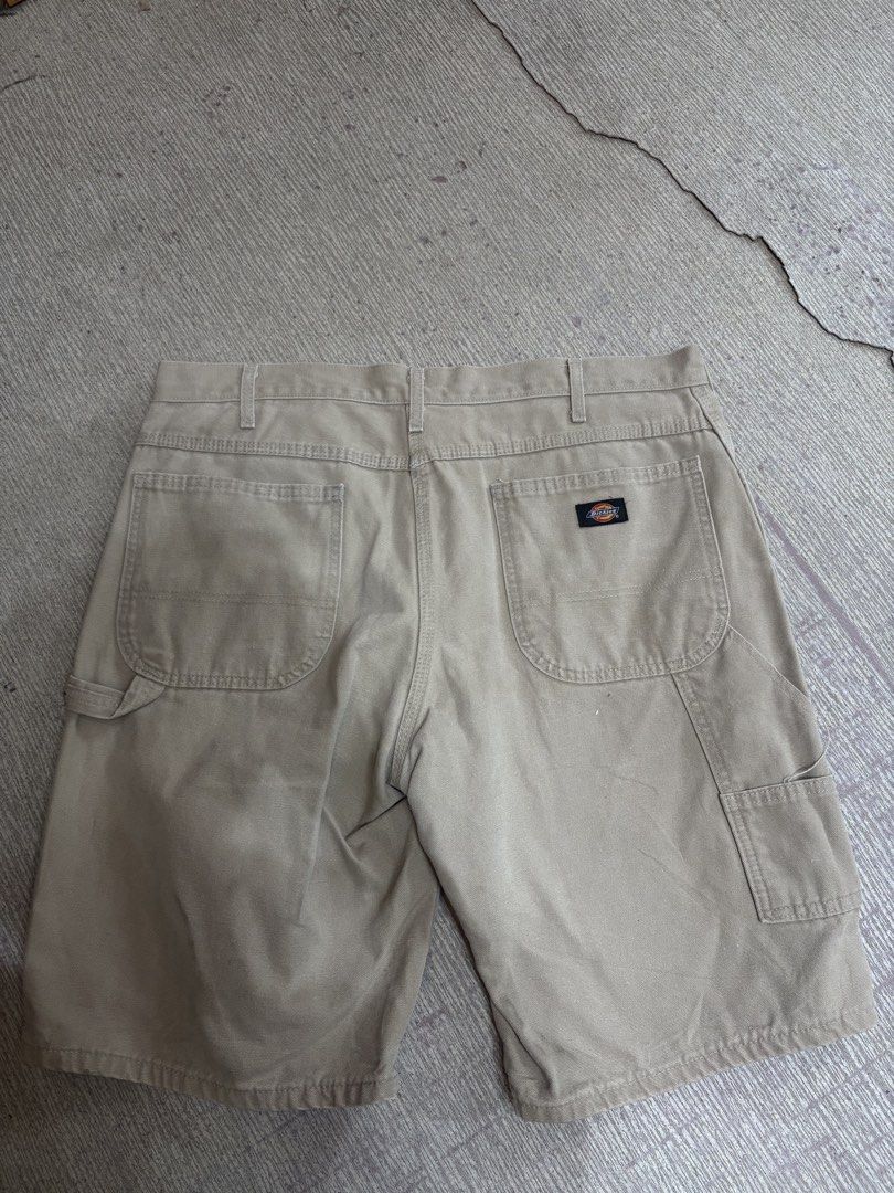Dickies Carpenter Shorts Size 36 Beige (Category: Shorts) located in Ajuy. Submitted by reeyn0515 (Listing ID 1464925410, Image 3). Description: - Brand: Dickies - Item: Carpenter Shorts - Color: Beige - Size: Waist 36 - Material: Heavy-duty cotton canvas - Features: Classic utility pockets, hammer loop, button closure with zip fly - Style: Standard fit, great for skate or workwear.