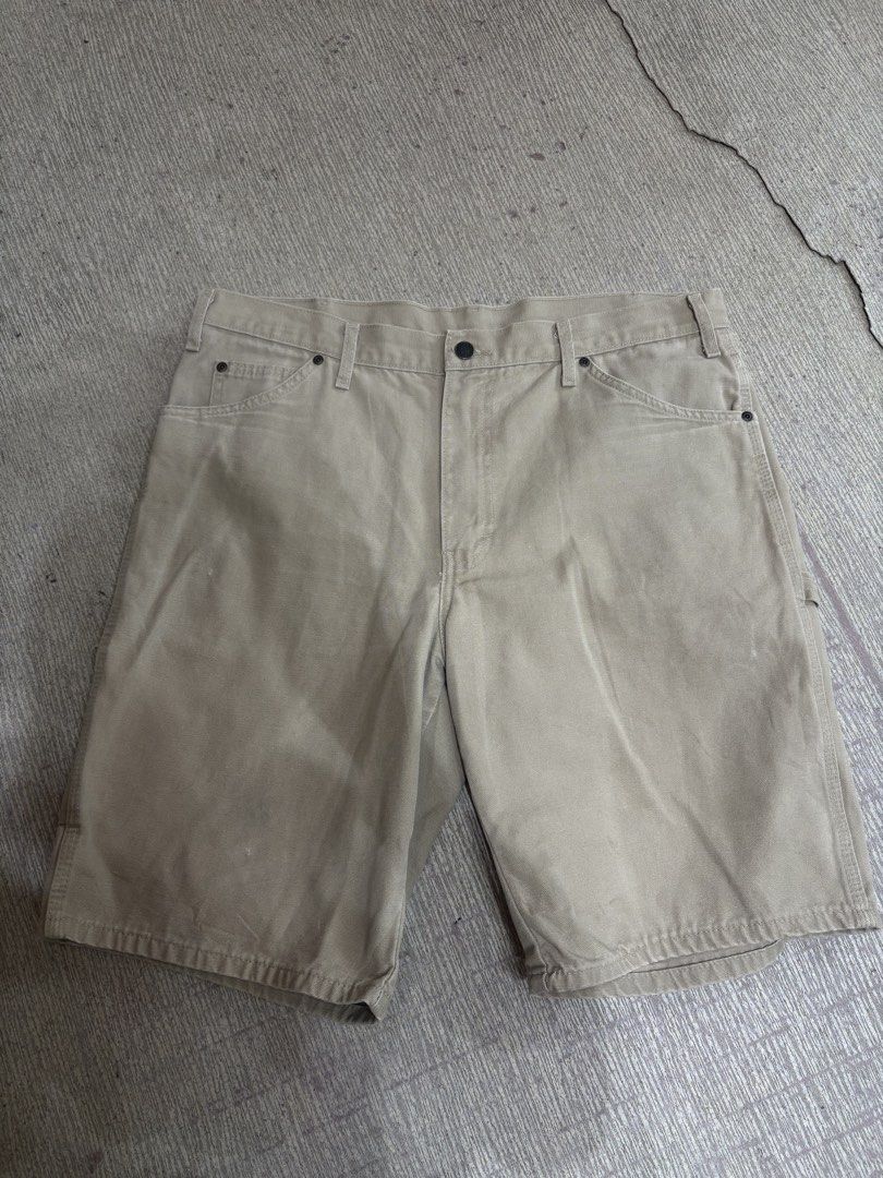 Dickies Carpenter Shorts Size 36 Beige (Category: Shorts) located in Ajuy. Submitted by reeyn0515 (Listing ID 1464925410, Image 2). Description: - Brand: Dickies - Item: Carpenter Shorts - Color: Beige - Size: Waist 36 - Material: Heavy-duty cotton canvas - Features: Classic utility pockets, hammer loop, button closure with zip fly - Style: Standard fit, great for skate or workwear.