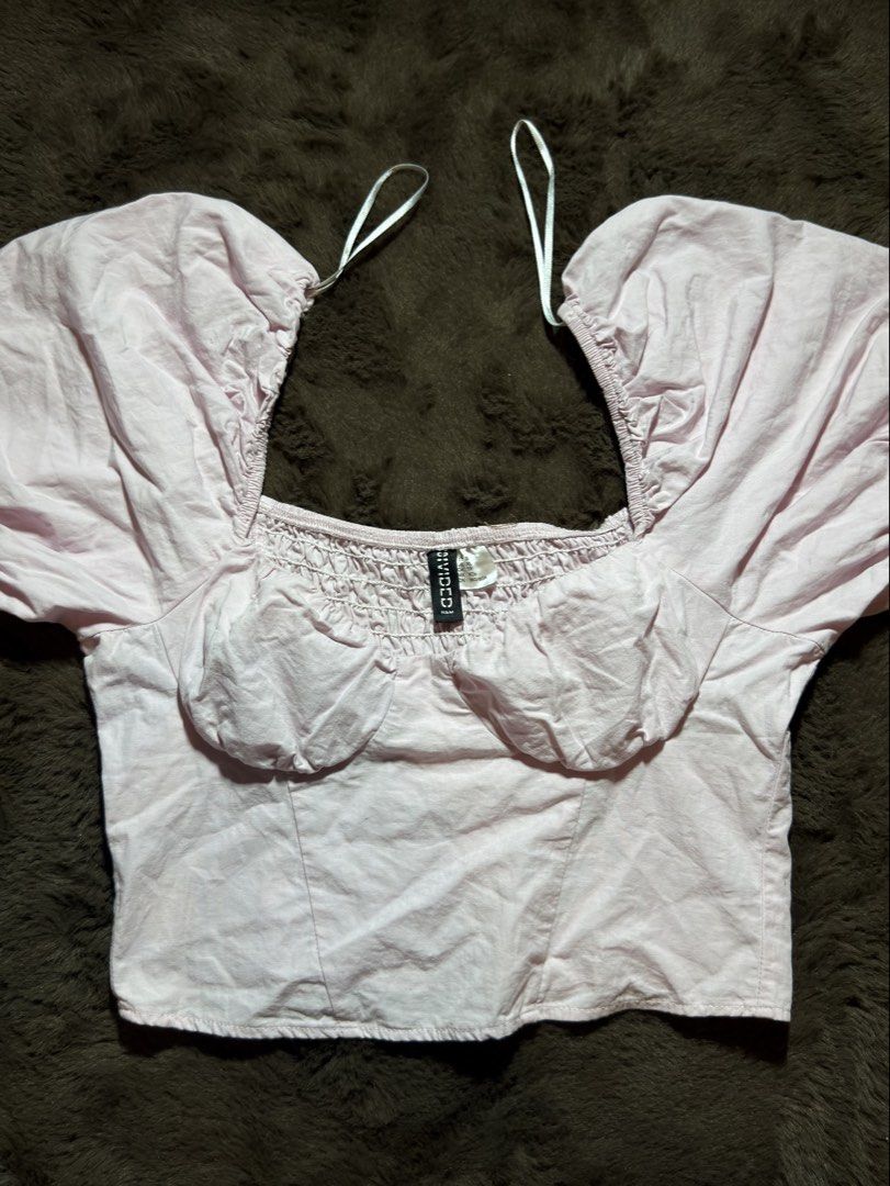 DIVIDED H&M light pink puff-sleeved cropped blouse (Category: Blouses) located in Valenzuela. Submitted by julijulyxoxo (Listing ID 1464884785, Image 2). Description: MOP: maribank, gcash, maya MOD: J&T Express Item is unwashed. Please wash immediately before wearing! 📍san miguel bulacan .