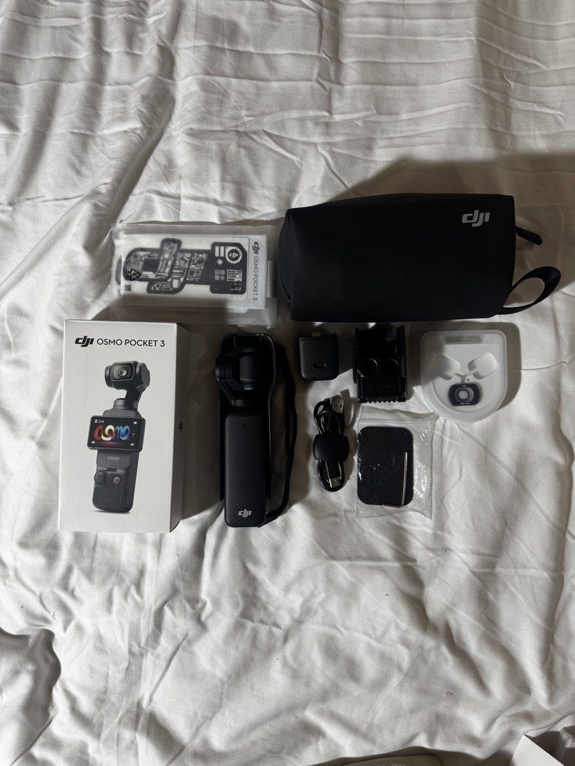 DJI Osmo Pocket 3 (Category: Cameras) located in Bacolod City. Submitted by lovedandprelovedbygee (Listing ID 1464852012, Image 2). Description: - DJI Osmo Pocket 3 camera, fully functional with rotating gimbal screen - Original box, protective case, and carrying pouch included - Type-C charging cable and power adapter - JSR wide-angle lens for wider shots - Extra mounting accessories and decal sticker sheet included - What you see in the picture