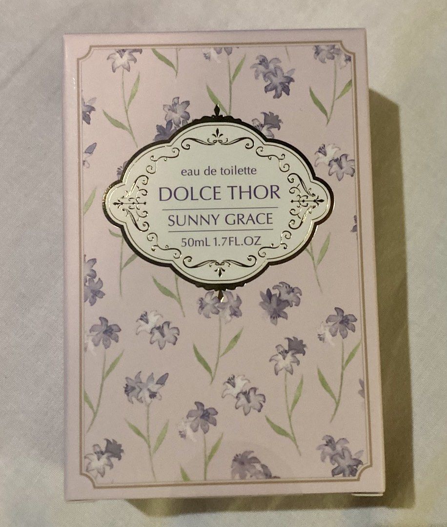 Dolce Thor Sunny Grace Eau de Toilette 50ml (Category: Fragrance & Deodorants) located in Pasig City. Submitted by nakamuraka (Listing ID 1464826859, Image 2). Description: - Brand: Dolce Thor Sunny Grace - Type: Eau de Toilette (EDT) - Size: 50ml - Condition: Brand new, never opened, and still sealed in original box - Packaging: Floral design in light purple and white with Japanese text on the back - Scent Profile: Fresh, clean, and great for ev