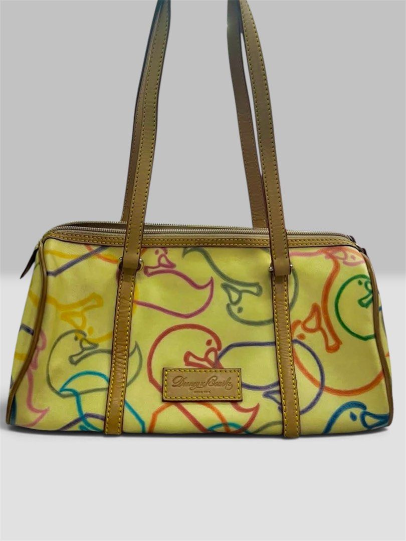 Dooney & Bourke (Category: Shoulder Bags) located in Bayombong. Submitted by declutterbyriri (Listing ID 1464887849, Image 1). Description: SOURCING!!! Vintage Dooney & Bourke Barrel Bag ₱1,500 SHIPPED Minimal lang issue niya, sobrang ganda pa niya. .
