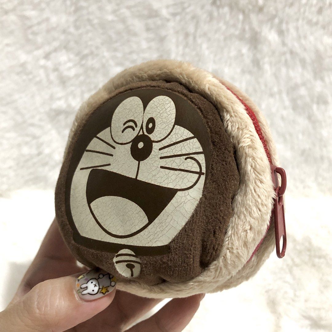 Doraemon Coin Purse Pouch (Category: Wallets & Card holders) located in Quezon City. Submitted by kitsune.treasures (Listing ID 1464926409, Image 1). Description: *First to pay policy! *1 day reservation only. Failure to pay on time, auto cancel. 📍Quezon City * MOD: J&T | Lalamove * MOP: GCASH | BPI 📦ON HAND AND READY TO SHIP! CONDITION: WHAT YOU SEE IS WHAT YOU GET. Dimensions: Kindly check the photos for the actual measurements. Please check 